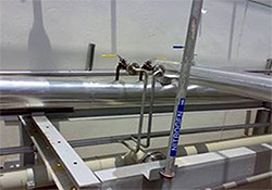 Low to high pressure steam piping system